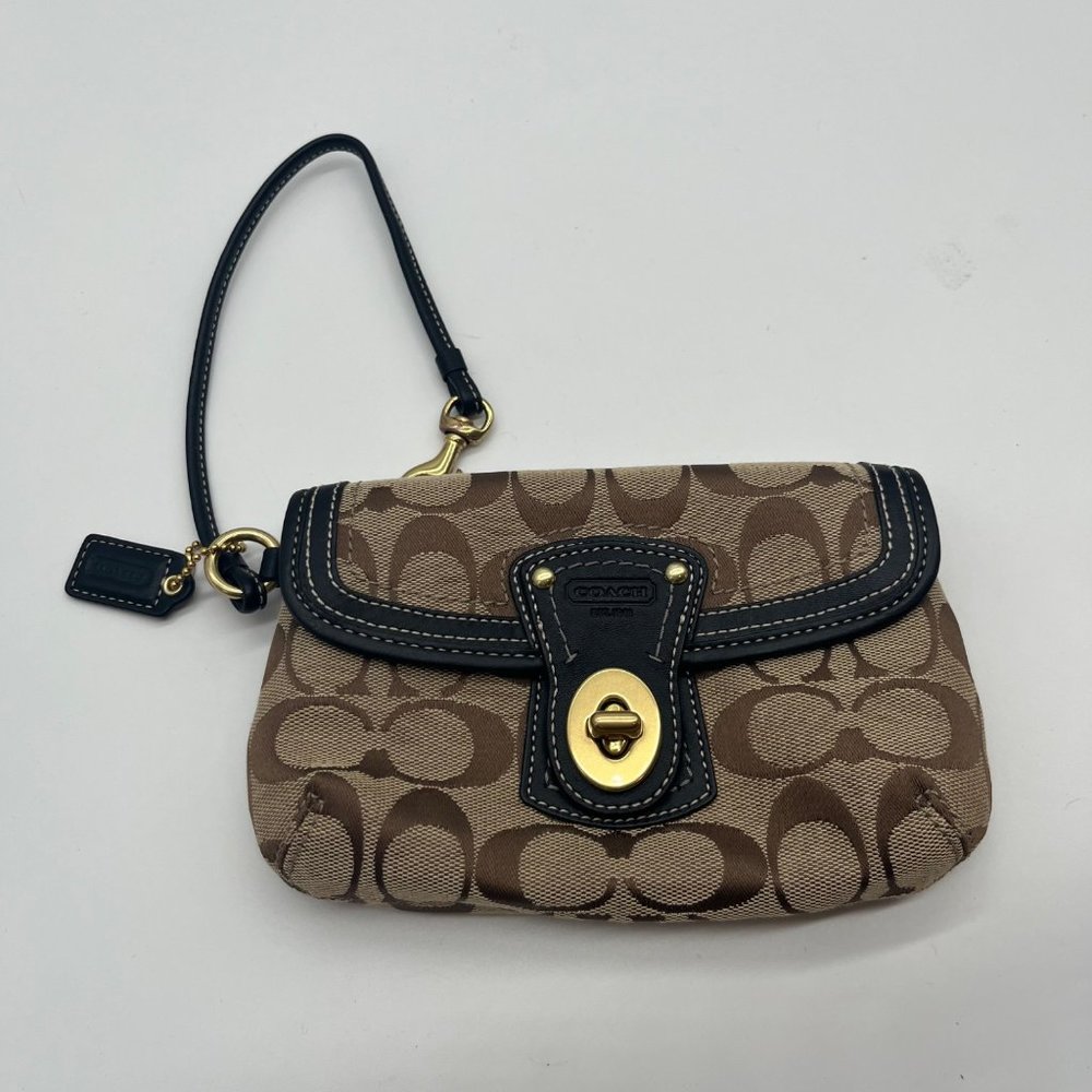 21. Coach Brown Signature Turn Lock Wristlet